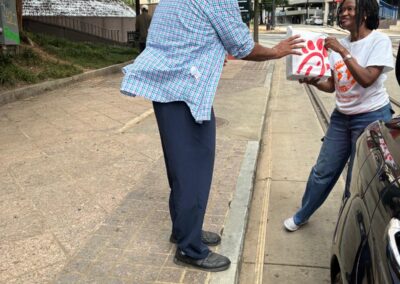 Serving the needy Globally Inc. Volunteers feeding the homeless  in Downtown Atlanta Georgia on Labor Day 09/07/2026