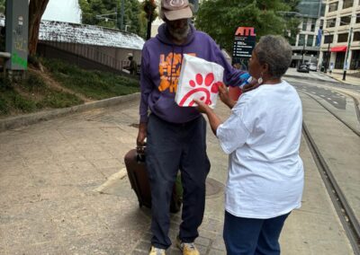 Serving the needy Globally Inc. Volunteers feeding the homeless  in Downtown Atlanta Georgia on Labor Day 09/07/2026