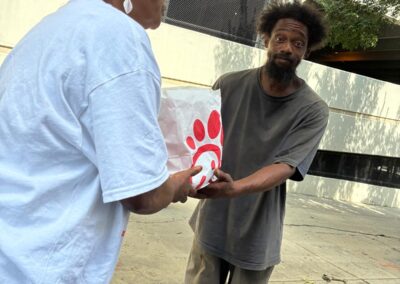Serving the needy Globally Inc. Volunteers feeding the homeless  in Downtown Atlanta Georgia on Labor Day 09/07/2026